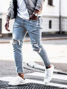 Мужские джинсы мужской уличная одежда колена разорванная тощая хип -хоп модные брюки с отверстиями Сплошной цвет мужской растяжка повседневная джинсовая ткань Большие брюки 230615