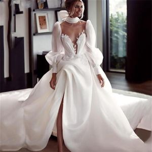 Splendidi abiti da sposa lunghi principessa bianco avorio Abiti da sposa Una linea Sheer Collo alto Puff maniche lunghe Abito da sposa in pizzo spaccato Cu218j