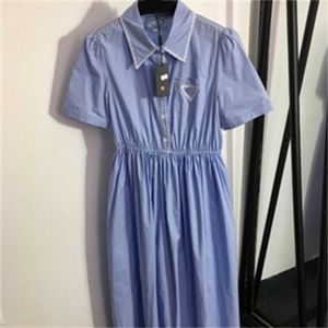 Vestidos de designer minimalista roupas femininas tecido de algodão puro lapela tecer bordado onda borda dobrada na cintura de manga curta vestido branco 55