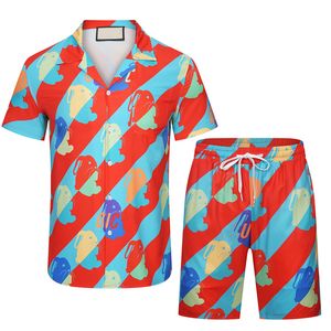 23 범죄 여름 패션 망 Tracksuits 하와이 비치 바지 세트 디자이너 셔츠 인쇄 레저 셔츠 남자 슬림 맞는 이사회 짧은 소매 짧은 해변