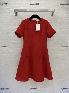 Plus Designer Designer Dress Rozmiar S-xl moda stałe kolory okrągły szyję sukienka z krótkim rękawem spódnica dekoracja kokardki czerwca 21