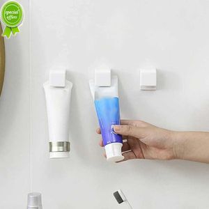 Ny icke-markering av badrum hängande klipp Multi-ändamål Tandkräm Rengöring Rack Plast Tandkräm Förvaringsklipp Tandkrämhållare
