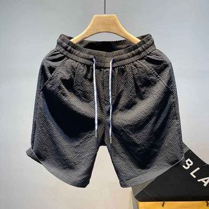 Calça de gelo de verão masculino calça curta solta de praia esportiva confortável de secagem rápida