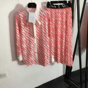 23ss gonna set donna abbigliamento firmato logo plaid stampato papillon camicia a maniche lunghe fettuccia a vita alta pieghettata mezza gonna set abbigliamento donna di alta qualità a1