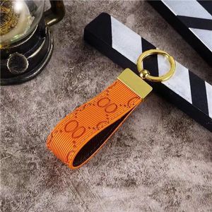 Luxury keychains couple style key chain handmade letter embossing bag charms men portachiavi gold plated part fashion car luxury keychains red green PJ068 C23