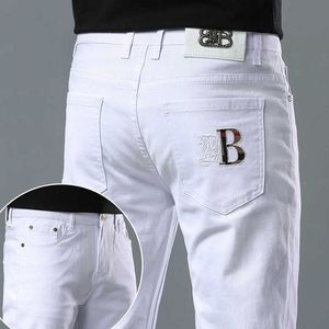 Mäns jeans designer designer 2023 Spring and Summer Jeans Men's Light Luxury Korean Version Thin Elastic Slim Cotton Pure White Trousers