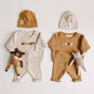 ins。韓国の子供用衣類男性と女性のセーターバージョンワッフルベビー服2ピースの外側の摩耗セット