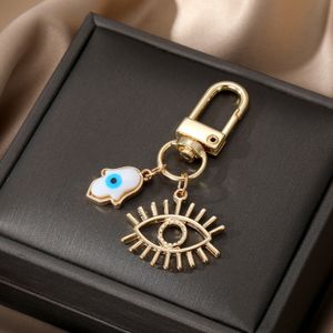 Klassisk design White Shell Evil Eye Key Rings Keychain Handbag Dekorera smycken för kvinnor