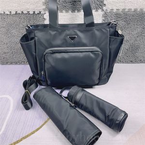حقيبة ظهر بتصميم حفاضات للسفر ذات سعة عالية منظم معزول مقاوم للماء ومكدس للحفاضات موضة فاخرة للأم حقيبة متعددة الألوان XB049 C23