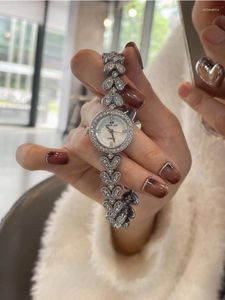Relógios de pulso Cinto de aço em forma de coração Relógio cheio de diamantes Luxo Alta qualidade Moda Feminina Nicho Lazer E Requintado Elegante