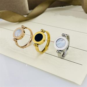 gioielli firmati anello di lusso per donna uomo anelli in oro conchiglia bianco e nero bifacciale girevole moda acciaio inossidabile gioiello282Q