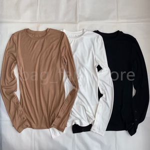 Högkvalitativa stickade skjortor för kvinnor med långärmad modedesigner lyxiga toppar svarta vita bruna stickor 25200