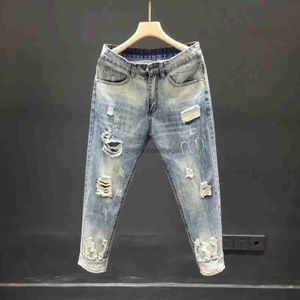 Mäns jeans 2023 Vår/sommar Ny män mode blå rippade stretch jeans män avslappnad smal bekväm stor storlek högkvalitativ byxor 28-36L231003