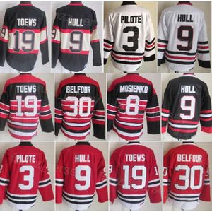 Uomo Vintage Hockey 19 Jonathan Toews Maglie Retro Classic 3 Pierre Pilote 9 Bobby Hull 8 Bill Mosienko 30 Ed Belfour 18 Denis Savard CCM Retire Nero Rosso Bianco Cucito