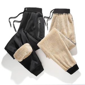 Marca dos homens inverno calças casuais calças de lã de cordeiro cintura elástica estiramento harem calças plus size 4xl grosso calças quentes preto grey264m