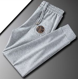 Mężczyźni swobodne spodnie haftowane spodnie designerskie spodnie sportowe luźne męskie dresowe presy m-5xl