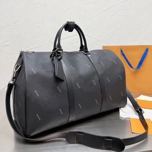 Bagage väska 50 cm hög kapacitet reseförsäljning kvinnor och mäns äkta läder axel modeväska handhållen bagage botten streckspåse fitness väska
