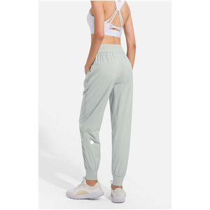 Luluemon Womens Lululu Women Jogging Yoga Ninth Pants Pocket Fiess Leggingsソフトハイウエストヒップリフトエラスティックカジュアルパンツドローストリングレギング