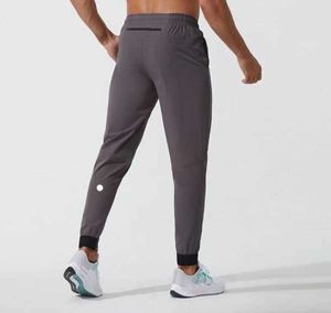 Korta byxor yoga outfit jogger sport snabb torr dragkammare gym fickor svettbyxor byxor mens casual elastic midje fitness lululemen 664ess