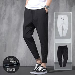 Pantaloni da uomo Pantaloni coreani elastici in seta di ghiaccio Quattro stagioni Sottili Casual da uomo Allentati 9 punti Grandi dimensioni Small Foot Sport Primavera 231010