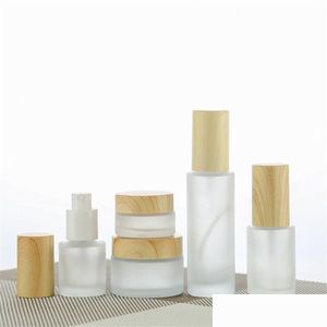 Packing Bottles Wholesale Frosted Glass Cream Jar Cosmetic Lotion Spray Bottle With Imitated Wooden Lids Refillable Container 20Ml 30M Dhvqs