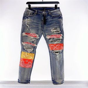 Patch di jeans firmati da uomo Fiori di anacardi Jeans strappati da uomo Jeans slim Pantaloni casual con cerniera per uomo Denim Hip Hop di alta qualità Pan240k