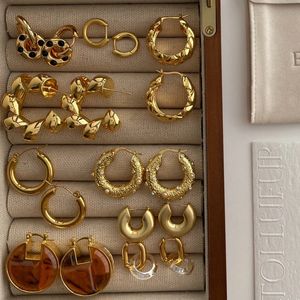 Qingdao fornecedor venda quente clássico vintage moda jóias brincos de argola de metal para presente feminino