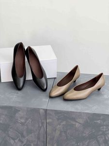 Cat heel shoes, paired with a small black dress or casual attire, classic women's business shoes
