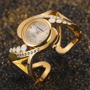 Andere Watche s Luxusmodemarke Armreif Golduhr Stahl Quarz Handgelenk für Frauen Montre Femme 231012