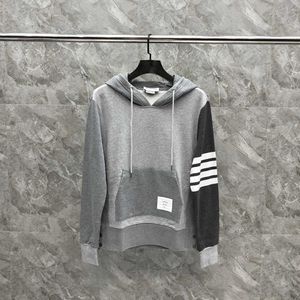 autumn and winter new grey hooded splicing long sleeved sweater for men and women