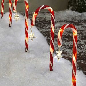 Dekoracje świąteczne 8pcs Outdoor Decorations Dekoracje słoneczne cukierki trzciny trzcinowe Wodoodporne LED Garden Pathway Lawn Light Xmas Nowy rok 2022 T231012