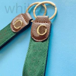 Key Rings Designer Designer Keychain Brown Leather Keyring Red and Green Webbing Bag Charms Fashion Gd Plated Accessories Buckle Grace Unisex PJ055 C23 29K7