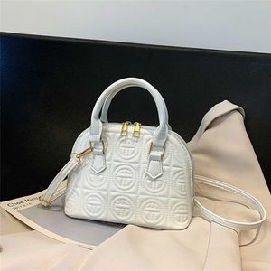 High grade feeling small bag for women's 2023 new summer trend fashion niche solid color portable one shoulder cross body shell number 7452