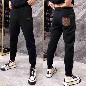 Tute da uomo firmate Pantaloni casual da uomo d'affari europei primaverili, tendenza nera, pantaloni larghi sportivi a gamba piccola tendenza BRU7