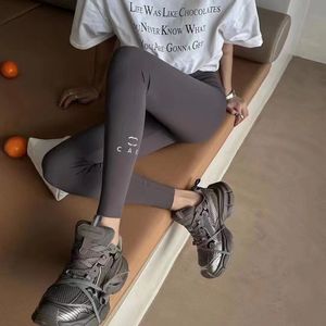 Tasarımcı Yüksek kaliteli streç köpekbalığı pantolon moda ince bacaklar yüksek bel göbeği asansör kalça tozluk fitness spor yoga pantolon