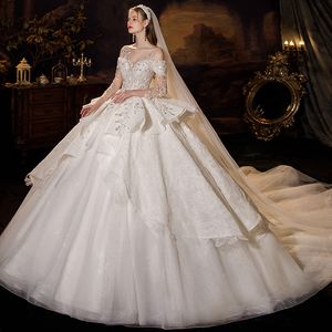 Abito da sposa arabo a maniche lunghe Dubai Plus Size Sweetheart abito lucido pizzo di cristallo in rilievo Sweep Train Abiti da sposa 2023 vintage Bling Luxury Perline Paillettes Abiti da sposa