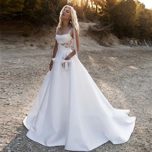 Szczególne koronkowe paski spaghetti satynowe liniowe suknie ślubne z kieszeniami patrz przez top otwarte formalne suknie ślubne 328