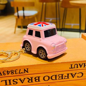 Cartoon personality alloy return car toy creative car keychain backpack pendant pair of ins small gifts cute and fun keychain