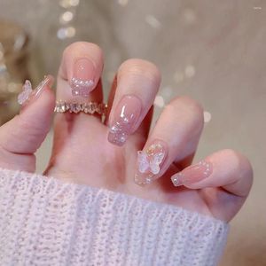 Unghie finte finte indossa una manicure a farfalla tridimensionale fatta a mano con diamanti spezzati rosa fata bianchi.