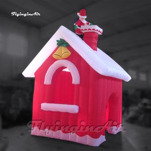 Cottage del villaggio di esplosione dell'aria del teatro della casa di Natale gonfiabile rosso festivo del cortile della casa con Babbo Natale per la decorazione esterna