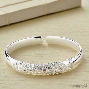 Bracciale rigido e pavone americano intagliato braccialetto aperto Cento pagoda braccialetto in lega temperamento moda femminile artigianato R231025