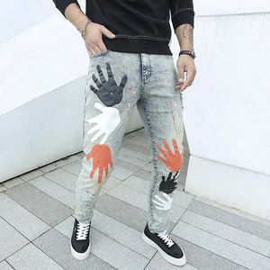 Jeans da uomo 2023 Uomo Streetwear Pantaloni strappati con toppe stampate Pantaloni slim alla moda Pantaloni casual in denim a matita da uomo