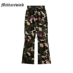 Męskie spodnie Hip Hop lupi plisowany kamuflaż Splash Ink Micro Flare Men Pants High Street luźne workowate dżinsy na nogi proste spodnie J231028