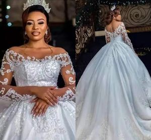 Arabo Aso Ebi Abito da ballo in pizzo Abiti da sposa per le donne africane Collo trasparente Maniche lunghe Principessa Abiti da sposa Bottoni posteriori Abiti in pizzo applicati Abiti da sposa CL2848