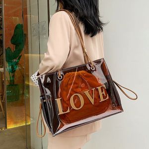 مصممة نساء واضحة PVC حقيبة حمل 2023 New Fashion Fashion كبيرة السعة الكتف الحقيبة الشفافة المتسوق محافظ على الشاطئ