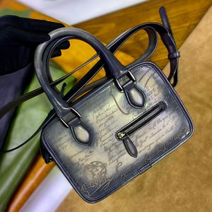 Messenger läder handväska axelväska mini portfölj italiensk kalvskinn omgivningsmetod handfärg polering gulliver scritto mönstrad läder portfölj