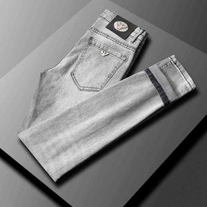 och vår sommar gråa jeans herrmode slim fit smalfots elastiska byxor med medelhög midja