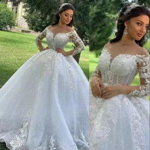 2022 A Line Wedding Gowns Illusion Jewel Neck Long Sleeves Arabic Plus Size Puffy Princess Lace Appliques Crystal Beads Sequined Ball Gown Bridal Party Dresse