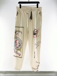 Męskie spodnie projektanci mężczyźni spodnie na co dzień Graffiti portret moking wysokiej jakości męskie damskie dresy modne spodnie Hip Hop odzież męska