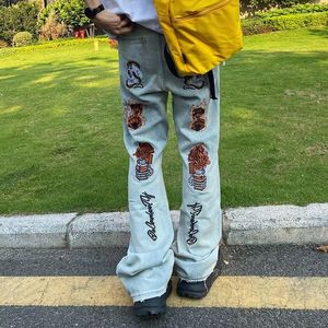 Jeans da uomo High Street Fiamma Teschio ricamato Marea Marchio Ruffian Pantaloni fritti belli Pantaloni svasati retrò americani